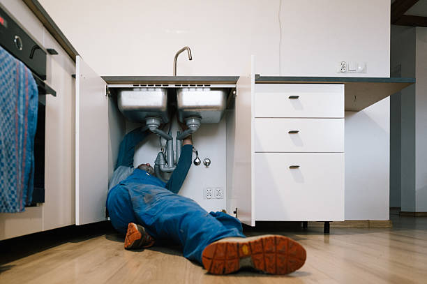 Professional Drain Cleaning technician working in Utica, NY